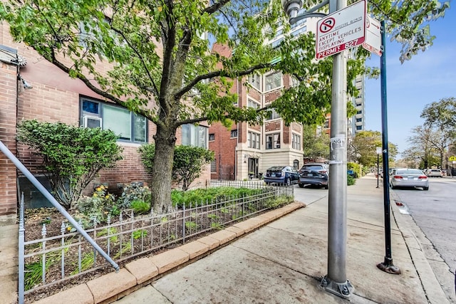 view of road with sidewalks and curbs