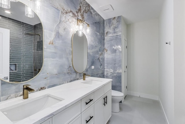 3242 N Kostner Ave, Chicago, IL 60641 - full bathroom featuring a sink, tile walls, double vanity, and toilet