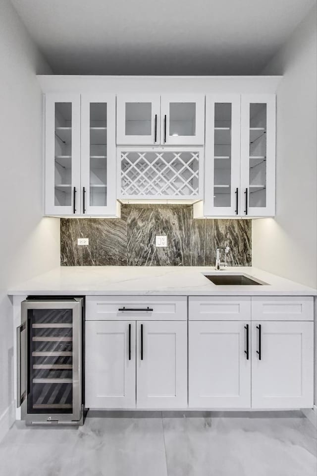 3242 N Kostner Ave, Chicago, IL 60641 - bar with wine cooler, wet bar, a sink, and backsplash