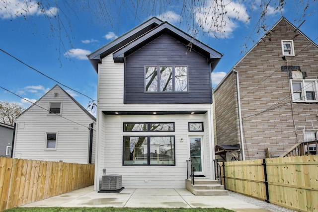 3242 N Kostner Ave, Chicago, IL 60641 - rear view of house with a patio area, fence private yard, and cooling unit