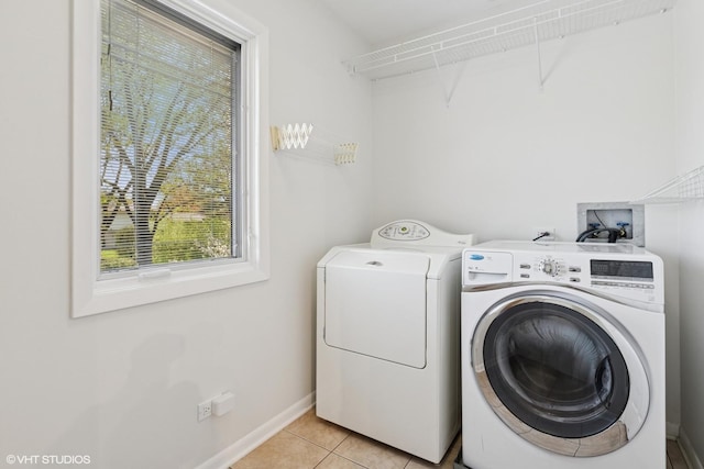 1831 Ellendale Dr, Northbrook, IL 60062 - laundry room with washing machine and clothes dryer, light tile patterned flooring, and baseboards