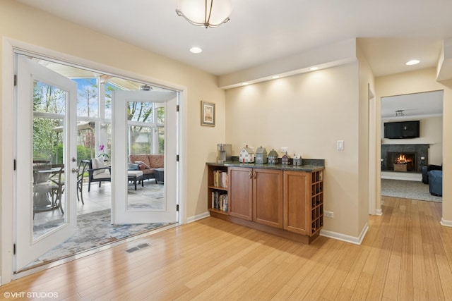 1831 Ellendale Dr, Northbrook, IL 60062 - bar featuring light wood-style flooring, a lit fireplace, baseboards, and recessed lighting