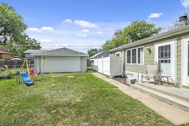 10922 Massasoit Ave, Chicago Ridge, IL 60415 - view of yard featuring fence, an outbuilding, a playground, and a detached garage