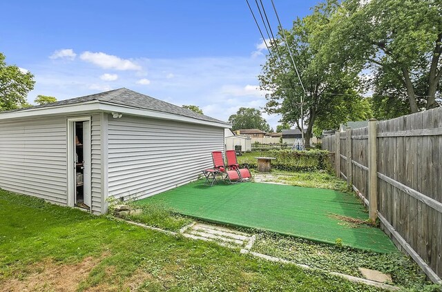 10922 Massasoit Ave, Chicago Ridge, IL 60415 - view of yard with an outdoor structure, a fenced backyard, and a wooden deck