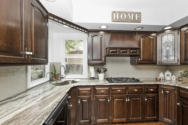 10922 Massasoit Ave, Chicago Ridge, IL 60415 - kitchen featuring custom range hood, dark brown cabinetry, black dishwasher, stainless steel gas stovetop, and a sink