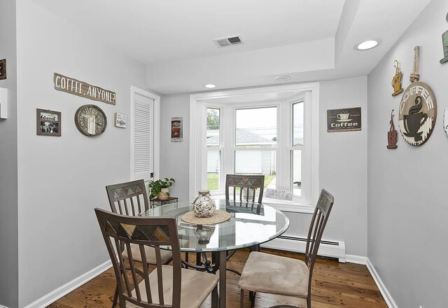 10922 Massasoit Ave, Chicago Ridge, IL 60415 - dining area with visible vents, recessed lighting, wood finished floors, a baseboard radiator, and baseboards