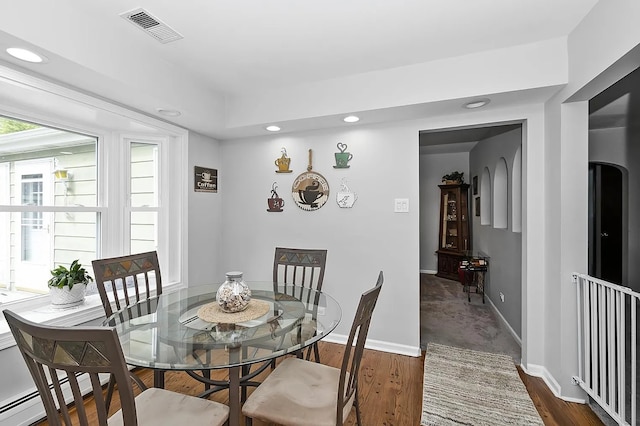 10922 Massasoit Ave, Chicago Ridge, IL 60415 - dining room featuring dark wood-type flooring, visible vents, a baseboard radiator, and recessed lighting
