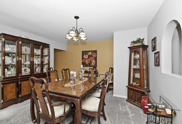 10922 Massasoit Ave, Chicago Ridge, IL 60415 - dining room featuring a notable chandelier, arched walkways, light colored carpet, and baseboards