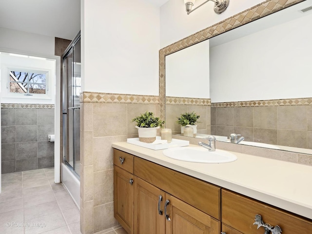 116 Springlake Ave, Hinsdale, IL 60521 - bathroom featuring tile patterned floors, vanity, tile walls, a wainscoted wall, and visible vents