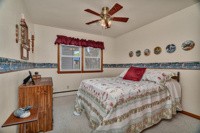 102 Robinson Dr, Morris, IL 60450 - bedroom featuring a baseboard radiator, carpet floors, baseboards, and a ceiling fan