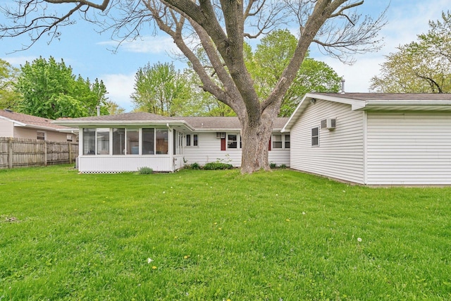 102 Robinson Dr, Morris, IL 60450 - rear view of house with a sunroom and a wall unit AC