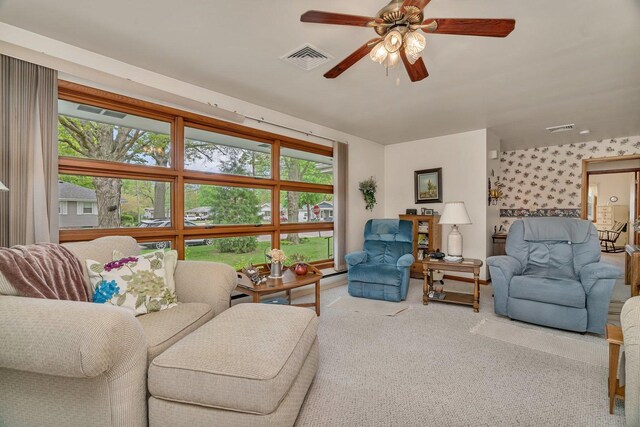 102 Robinson Dr, Morris, IL 60450 - living area with carpet flooring, ceiling fan, and wallpapered walls