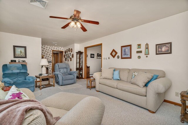 102 Robinson Dr, Morris, IL 60450 - carpeted living room featuring a ceiling fan and baseboards