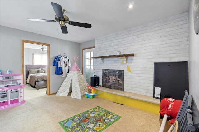 313 W S St, Pearl City, IL 61062 - game room with a wealth of natural light, a fireplace, carpet, and ceiling fan