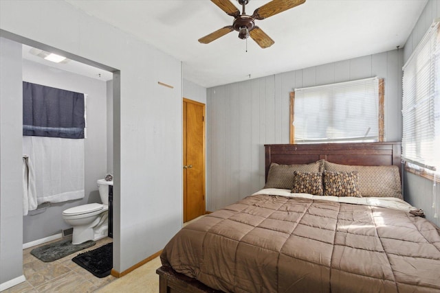 313 W S St, Pearl City, IL 61062 - bedroom featuring ceiling fan, ensuite bathroom, baseboards, and multiple windows