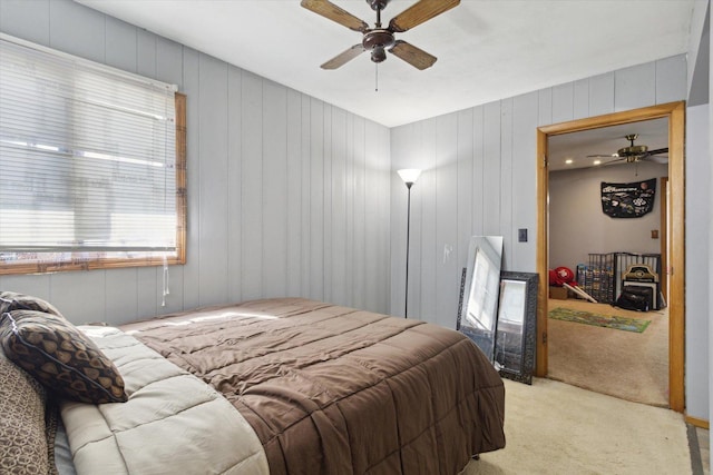 313 W S St, Pearl City, IL 61062 - bedroom featuring light colored carpet, wooden walls, and a ceiling fan