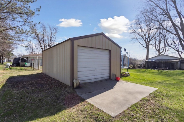 313 W S St, Pearl City, IL 61062 - detached garage featuring a trampoline and driveway