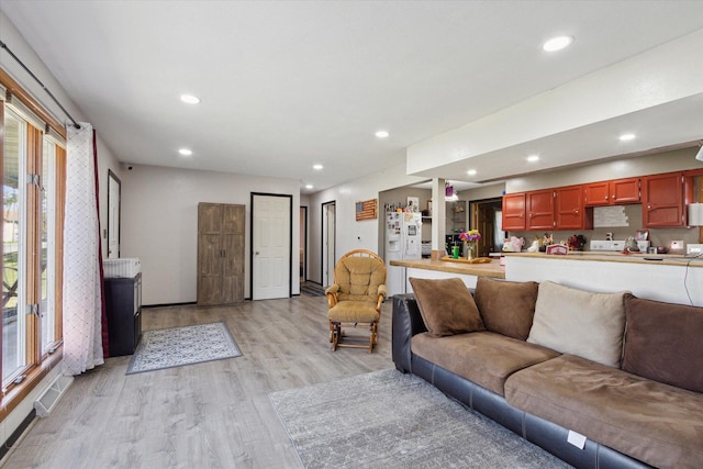 313 W S St, Pearl City, IL 61062 - living room with light wood-style flooring, recessed lighting, plenty of natural light, and baseboards