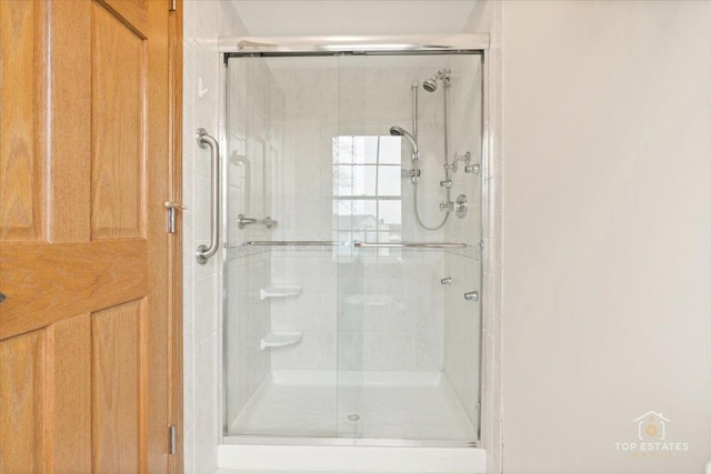 bathroom with a shower stall