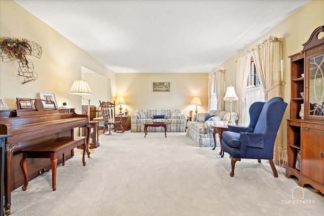 living area with light carpet