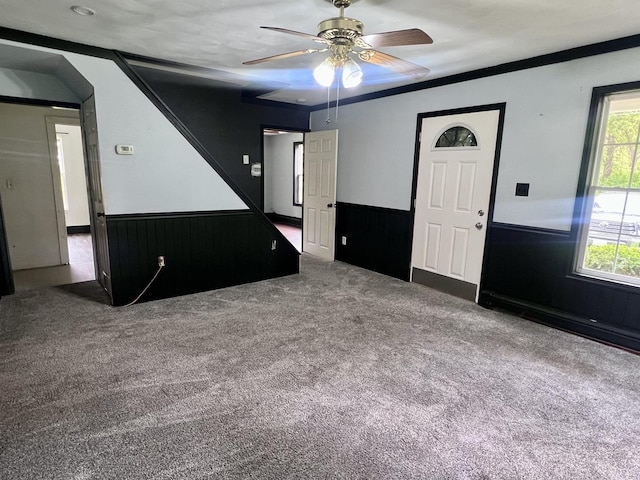 2215 Deets Rd, Sterling, IL 61081 - carpeted spare room with plenty of natural light, ceiling fan, and wainscoting