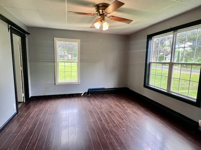 2215 Deets Rd, Sterling, IL 61081 - unfurnished room featuring ceiling fan, dark wood finished floors, and baseboards