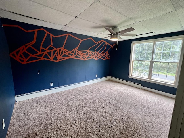2215 Deets Rd, Sterling, IL 61081 - carpeted spare room with a ceiling fan, a baseboard radiator, baseboards, and a drop ceiling