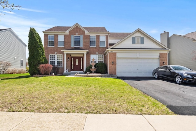 24117 Nottingham Ave, Plainfield, IL 60585 - colonial house featuring brick siding, driveway, an attached garage, and a front lawn