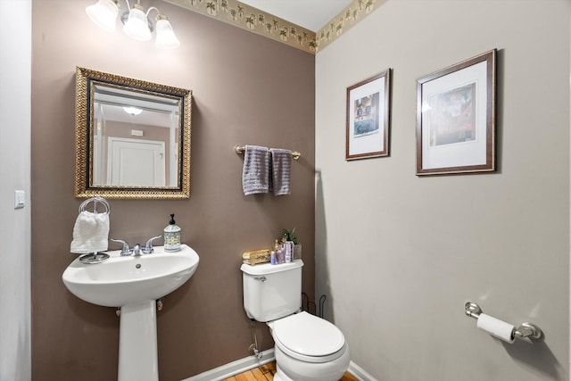 24117 Nottingham Ave, Plainfield, IL 60585 - half bathroom with toilet, a sink, and baseboards