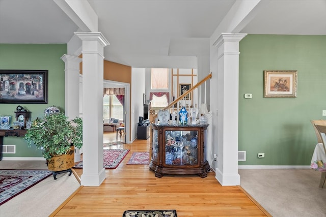 24117 Nottingham Ave, Plainfield, IL 60585 - interior space featuring ornate columns, baseboards, and wood finished floors