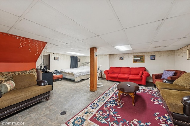 living area featuring a paneled ceiling