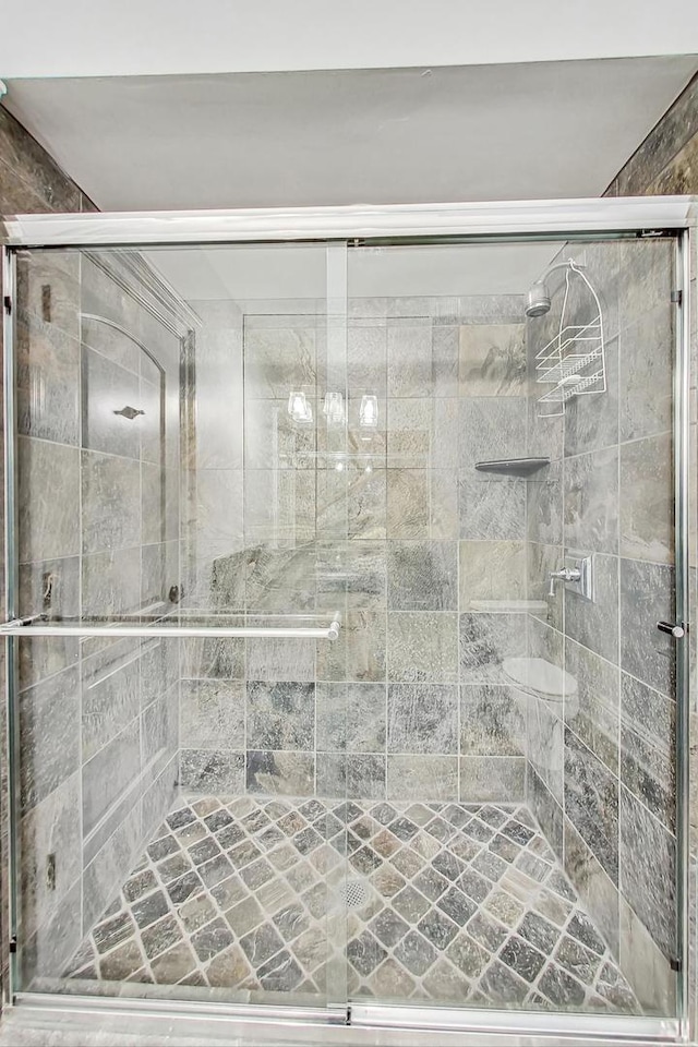 bathroom featuring a shower stall