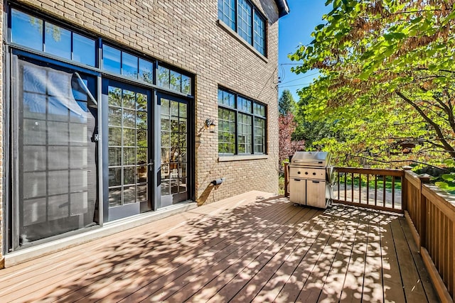 deck featuring a grill