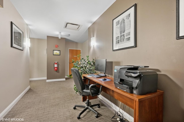 carpeted office space with attic access, baseboards, and lofted ceiling