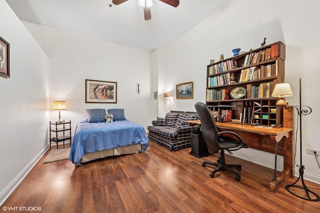 bedroom featuring wood finished floors and baseboards