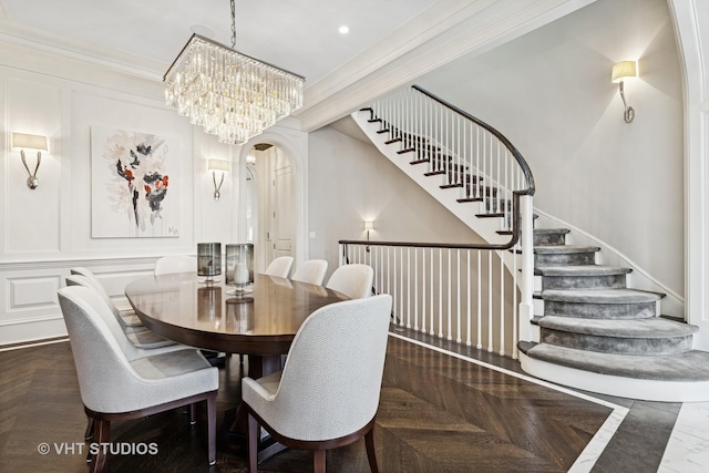 2140 N Seminary Ave, Chicago, IL 60614 - dining space with arched walkways, ornamental molding, a chandelier, and stairs
