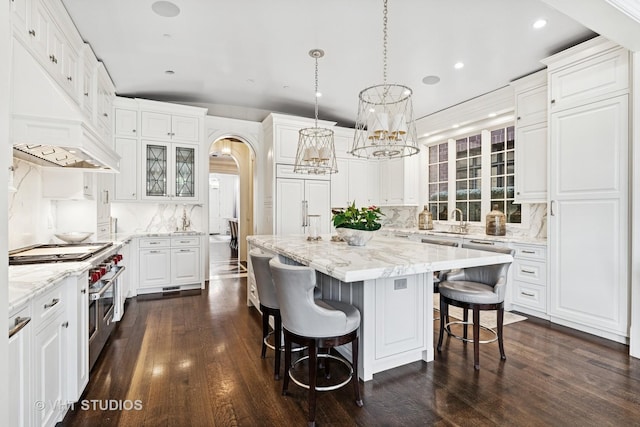 2140 N Seminary Ave, Chicago, IL 60614 - kitchen with white cabinets, decorative backsplash, a kitchen island, and dark wood-type flooring