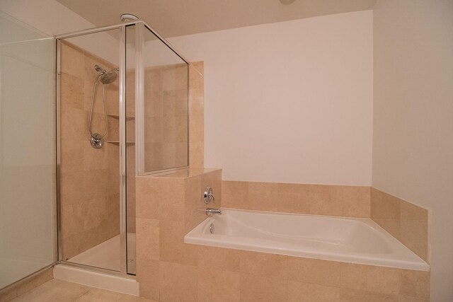 565 W Quincy St Unit 510, Chicago, IL 60661 - bathroom featuring a shower stall and a garden tub