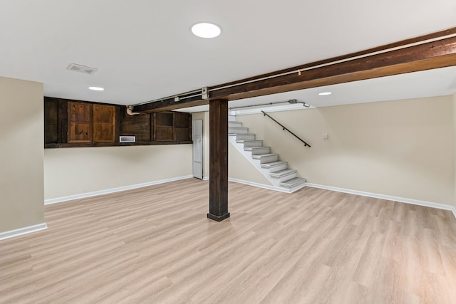 7730 Virginia Ct, Willowbrook, IL 60527 - finished basement featuring visible vents, baseboards, light wood-type flooring, and stairs