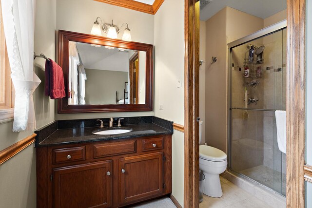 full bath with a shower stall, toilet, vanity, and tile patterned flooring