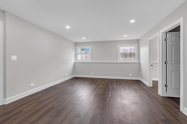 interior space featuring dark wood-style flooring, baseboards, and recessed lighting