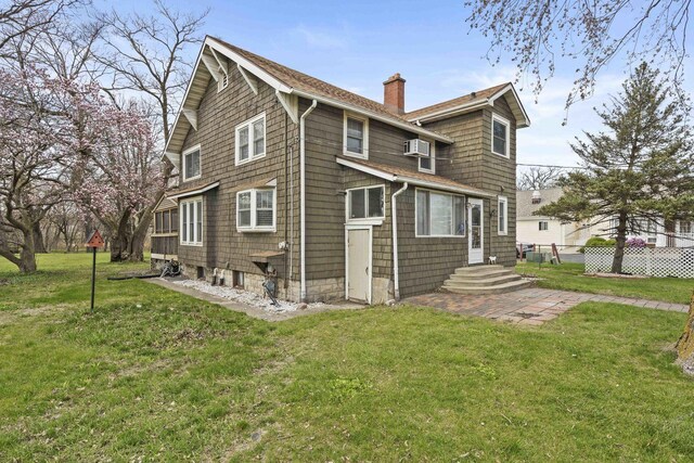 1856 Bernice Rd, South Holland, IL 60473 - back of property with entry steps, a lawn, a chimney, and fence