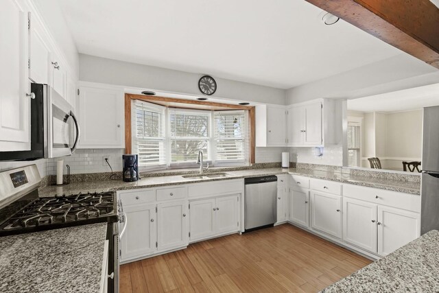 1856 Bernice Rd, South Holland, IL 60473 - kitchen featuring white cabinets, stainless steel appliances, and a sink