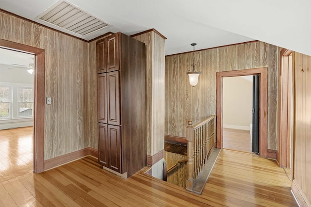 1856 Bernice Rd, South Holland, IL 60473 - hall featuring wood walls, an upstairs landing, light wood-type flooring, baseboards, and visible vents
