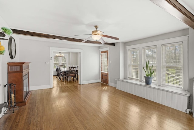 1856 Bernice Rd, South Holland, IL 60473 - living room with baseboards, hardwood / wood-style floors, and ceiling fan with notable chandelier