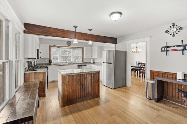 1856 Bernice Rd, South Holland, IL 60473 - kitchen with beamed ceiling, light wood-style flooring, white cabinets, and appliances with stainless steel finishes