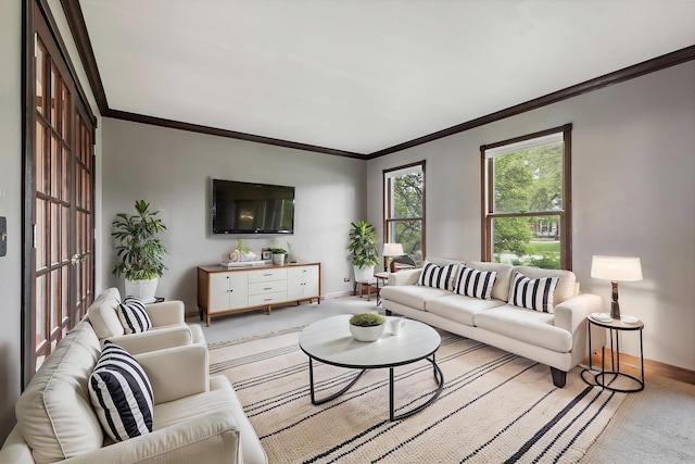 living area featuring baseboards, light colored carpet, and ornamental molding