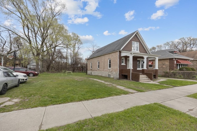 7521 S Parnell Ave, Chicago, IL 60620 - view of front of home with a front lawn and roof with shingles