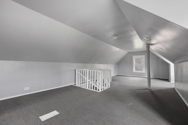 7521 S Parnell Ave, Chicago, IL 60620 - additional living space featuring visible vents, vaulted ceiling, baseboards, and carpet flooring