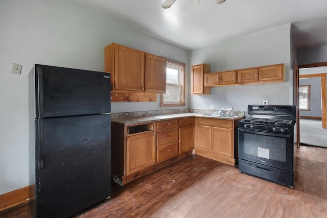 7521 S Parnell Ave, Chicago, IL 60620 - kitchen featuring black appliances and dark wood-style floors